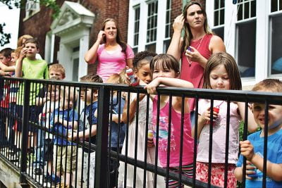 Students of the Monument Square Early Childhood Center at Child Care of the Berkshires lined up outside the Haskins facility on Thursday to celebrate more than $1 million in renovations announced for the school building. Thursday, June 8, 2017. Adam Shanks — The Berkshire Eagle